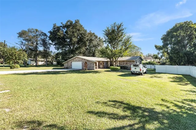 a swimming pool view with a outdoor seating