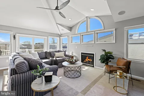 a kitchen with granite countertop a table chairs stove and cabinets