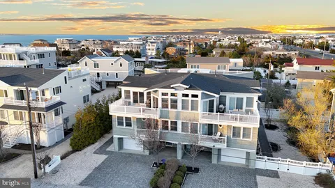 an aerial view of multiple houses with yard