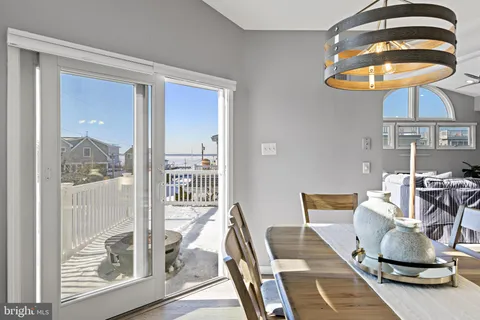 a living room with furniture and a lamp