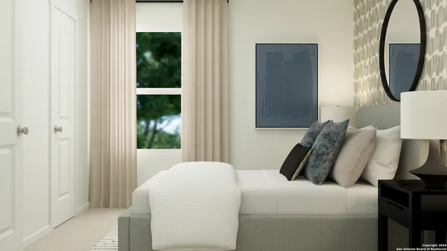 a bedroom with a bed and a mirror