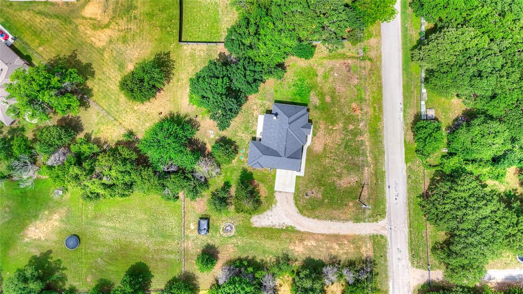 1355 Jay Bird Road Springtown, TX 76082 - Photo 40 of 40 an aerial view of residential house with outdoor space and trees all around