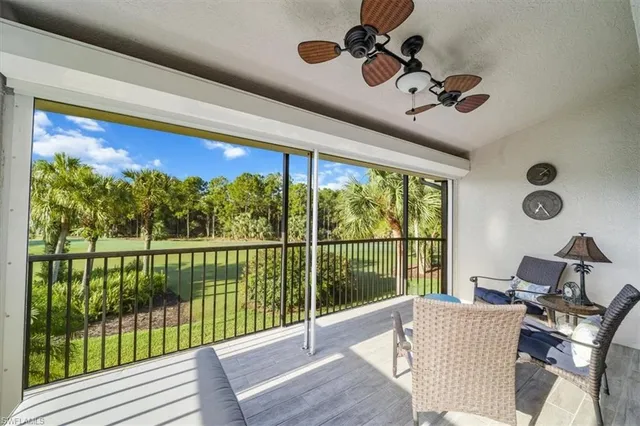 a view of a dining room with furniture a chandelier and wooden floor