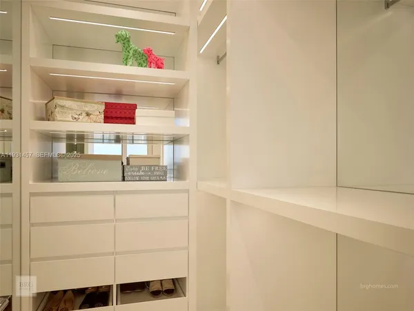 a cabinet with white cabinets