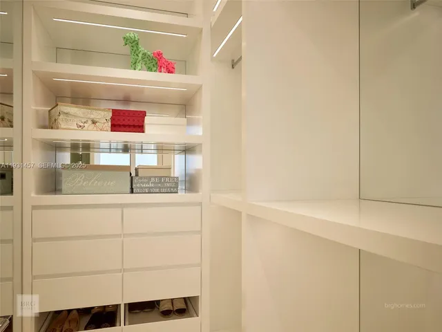 a cabinet with white cabinets