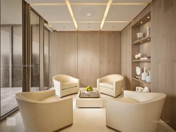 a living room with furniture and white walls