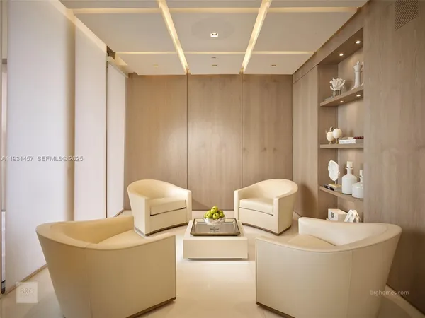 a living room with furniture and white walls