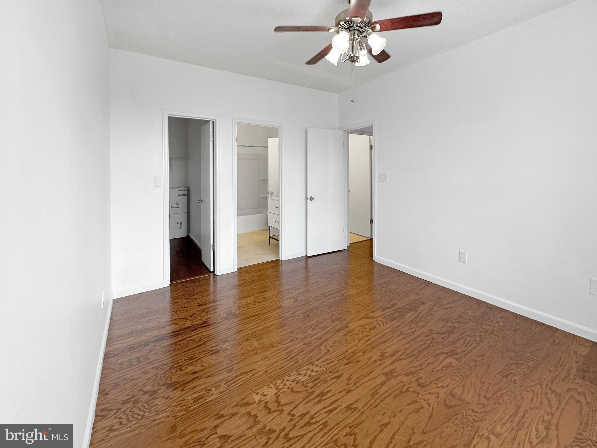 7205 Bogley Road, Unit 202 Baltimore, MD 21244 - Photo 8 of 11 a view of an empty room with wooden floor