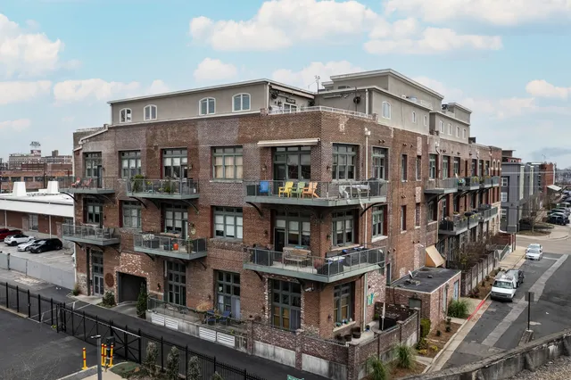 a front view of a building with retail shops