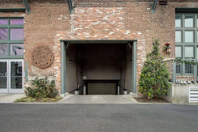 a brick building with a entrance door