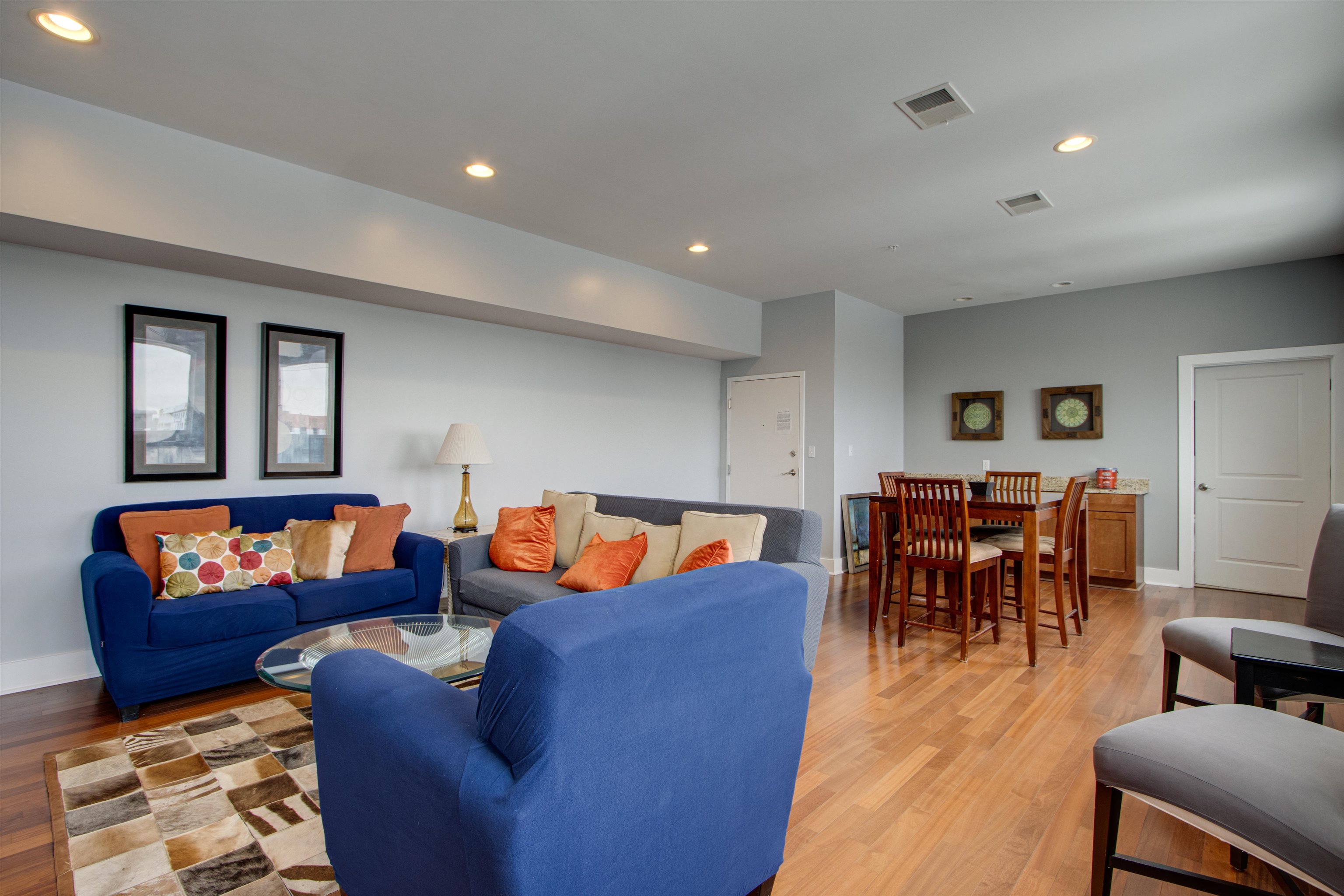 435 South Front Street, Unit 105 Memphis, TN 38103 - Photo 39 of 40 a living room with furniture and wooden floor