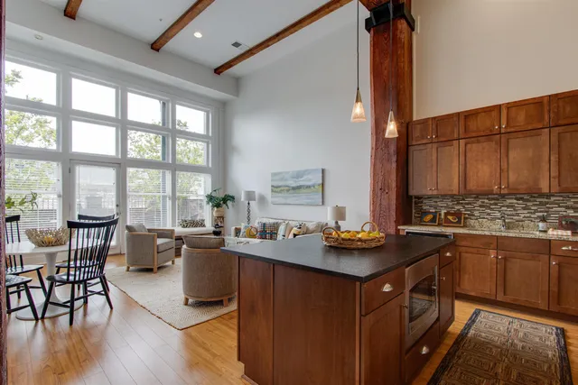 a kitchen with a stove a sink and a refrigerator