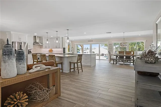 a room with lots of wooden furniture and a table