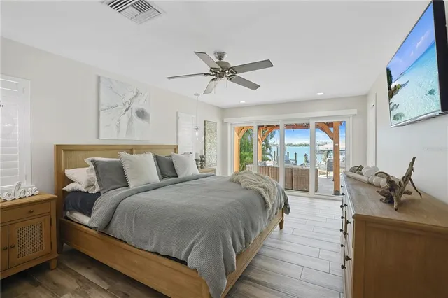 a bed room with a bed and a chandelier