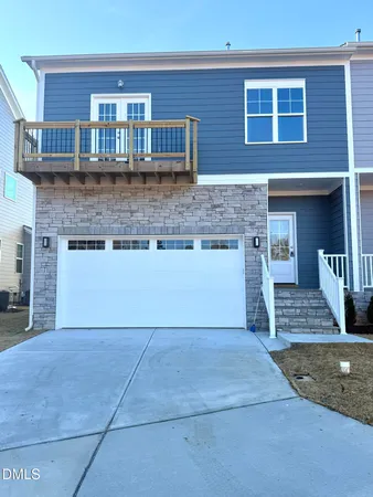 a view of open kitchen with granite countertop cabinets and oven