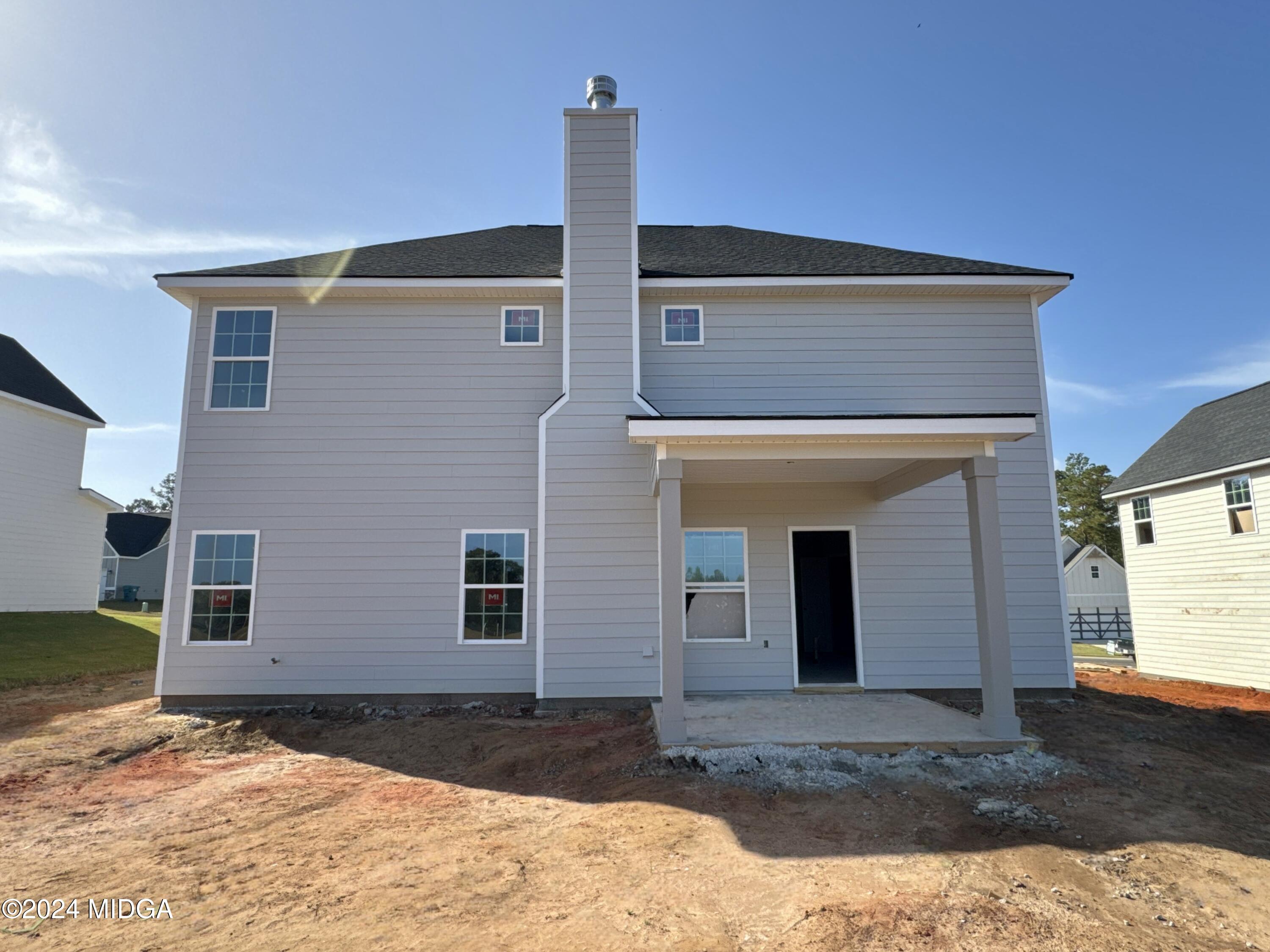 312 East River Cane Run, Unit 30G Perry, GA 31069 - Photo 2 of 2 a front view of a house with a yard