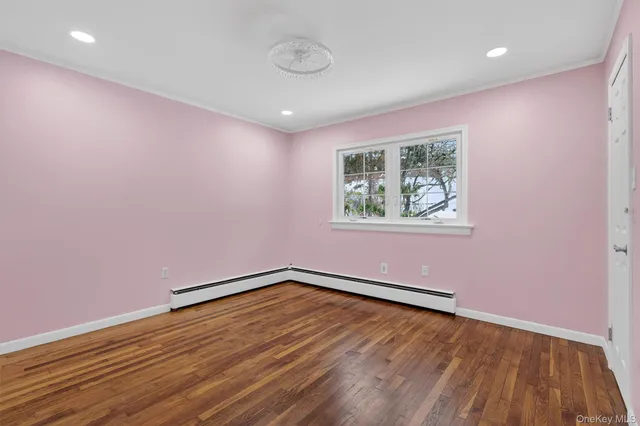 a view of closet with wooden floor