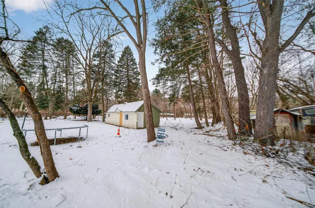a view of a house with a snow in the yard