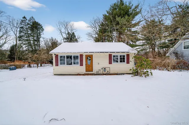 a house with trees in the background