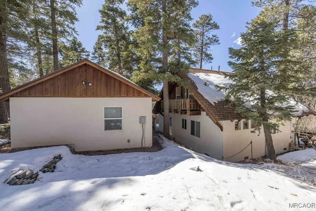 a view of a backyard of the house
