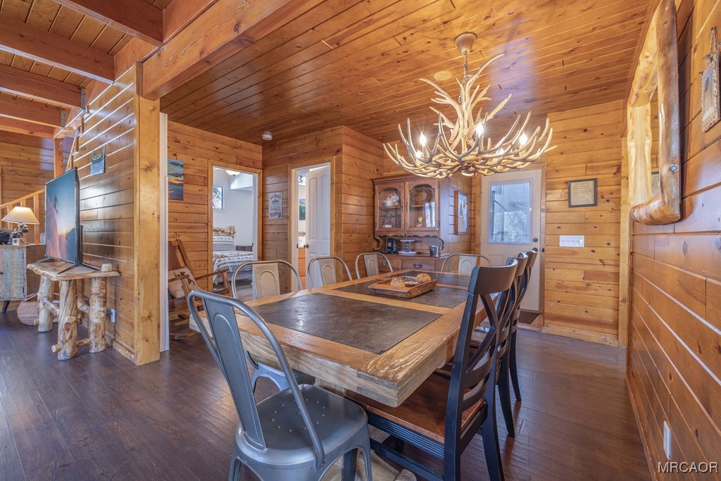 43411 Sheephorn Road Big Bear Lake, CA 92315 - Photo 13 of 50 a dining room with furniture a chandelier and wooden floor