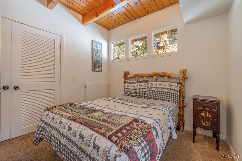 43411 Sheephorn Road Big Bear Lake, CA 92315 - Photo 16 of 50 a bedroom with a bed and a dresser