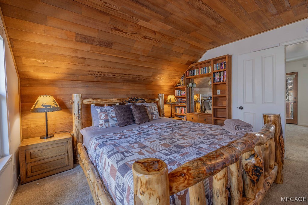 43411 Sheephorn Road Big Bear Lake, CA 92315 - Photo 23 of 50 a bed sitting in a spacious bedroom next to a window