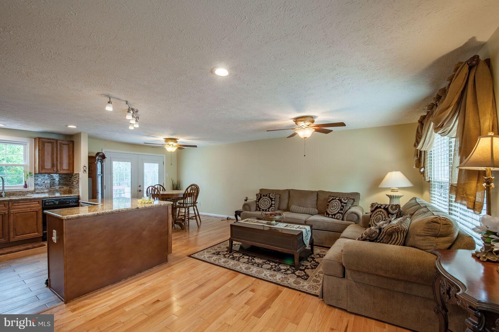5106 Clifford Road Perry Hall, MD 21128 - Photo 11 of 30 a living room with furniture and a chandelier