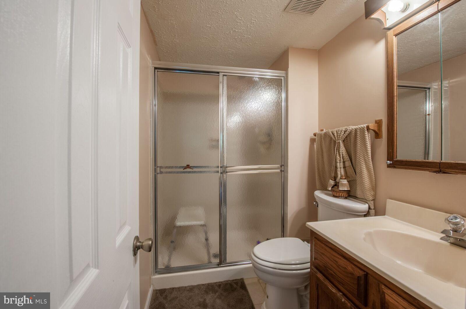 5106 Clifford Road Perry Hall, MD 21128 - Photo 17 of 30 a bathroom with a sink toilet and shower