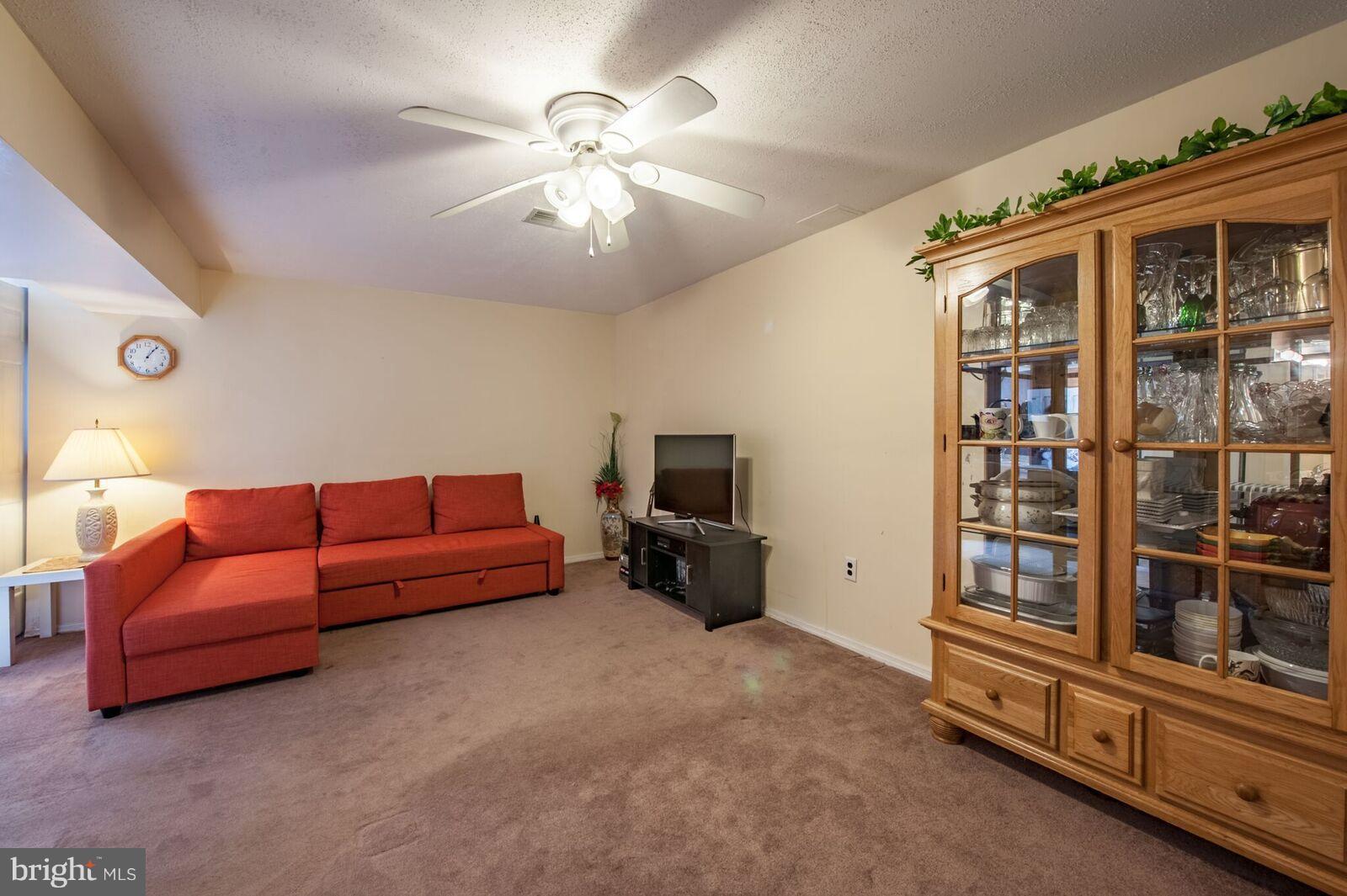 5106 Clifford Road Perry Hall, MD 21128 - Photo 20 of 30 a living room with furniture and a flat screen tv