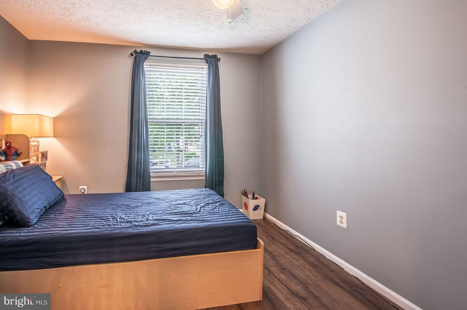 5106 Clifford Road Perry Hall, MD 21128 - Photo 24 of 30 a bedroom with a bed and a window