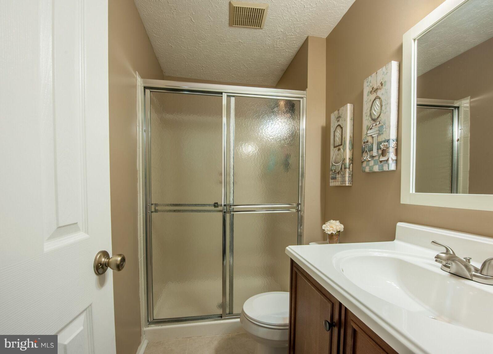 5106 Clifford Road Perry Hall, MD 21128 - Photo 29 of 30 a bathroom with a sink toilet and shower
