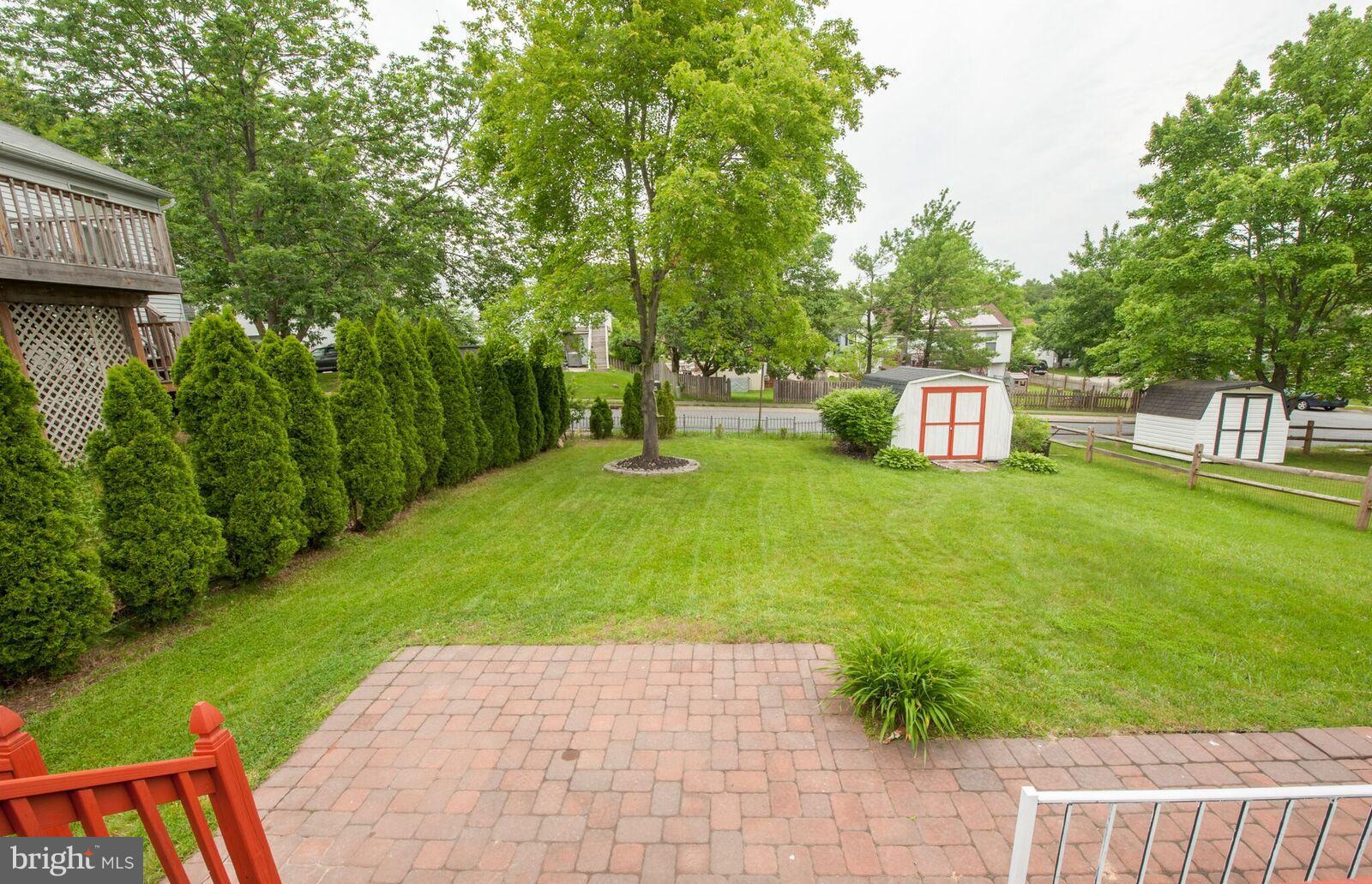 5106 Clifford Road Perry Hall, MD 21128 - Photo 5 of 30 a view of backyard with a table and chairs and potted plants