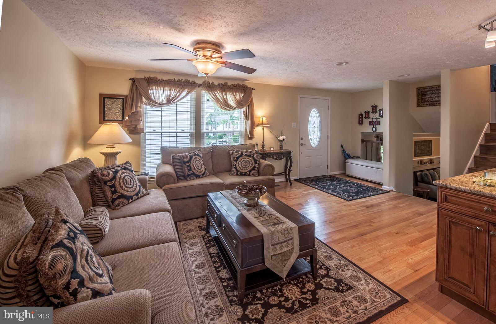 5106 Clifford Road Perry Hall, MD 21128 - Photo 9 of 30 a living room with furniture a chandelier and a dining table