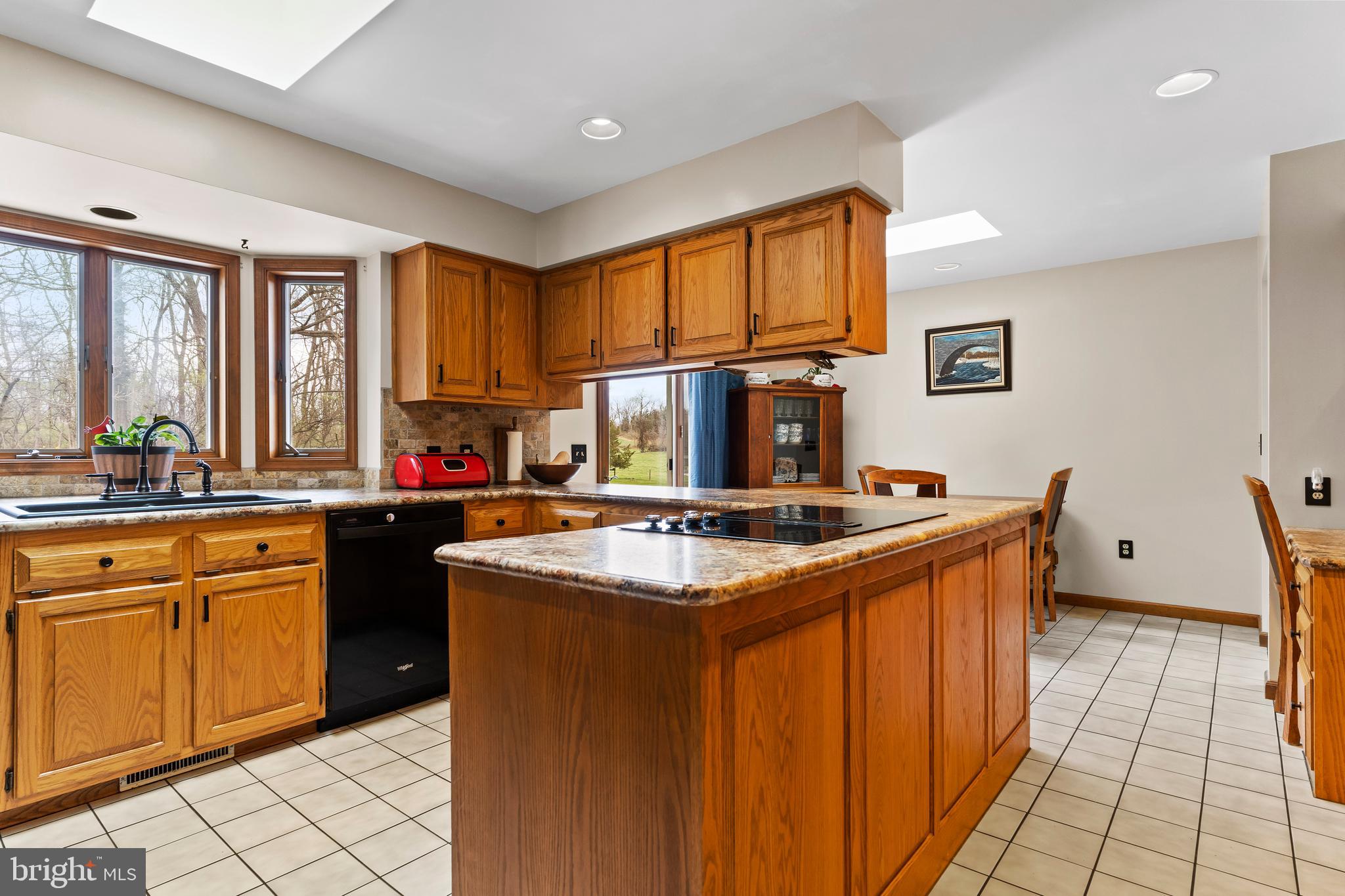 540 Springfield Road Newville, PA 17241 - Photo 19 of 59 a kitchen with granite countertop a sink stove and cabinets