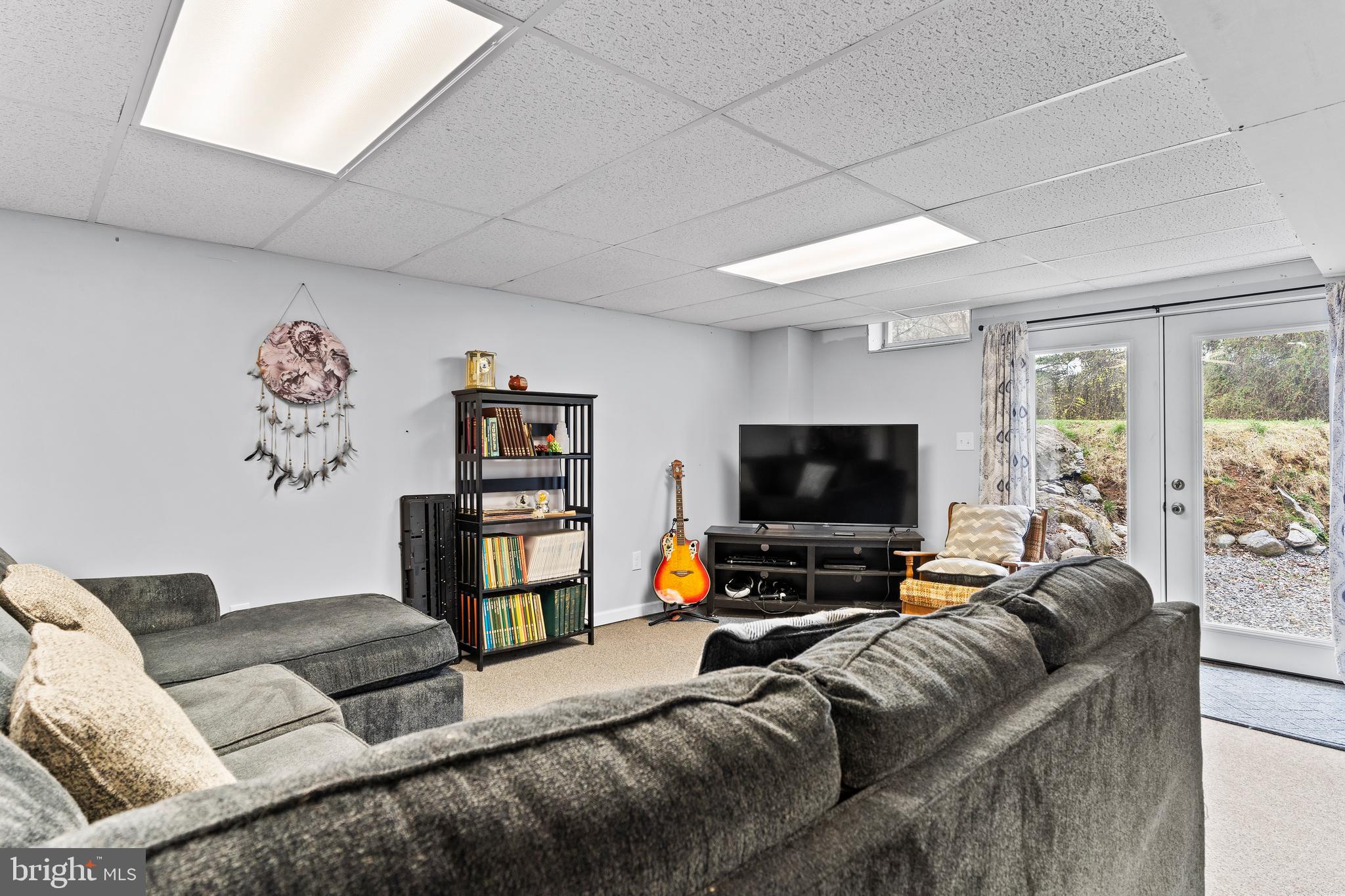540 Springfield Road Newville, PA 17241 - Photo 36 of 59 a living room with furniture and a flat screen tv