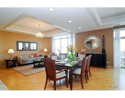 3535 Patten Road, Unit 7E Highland Park, IL 60035 - Photo 3 of 14 a view of a dining room with furniture and wooden floor