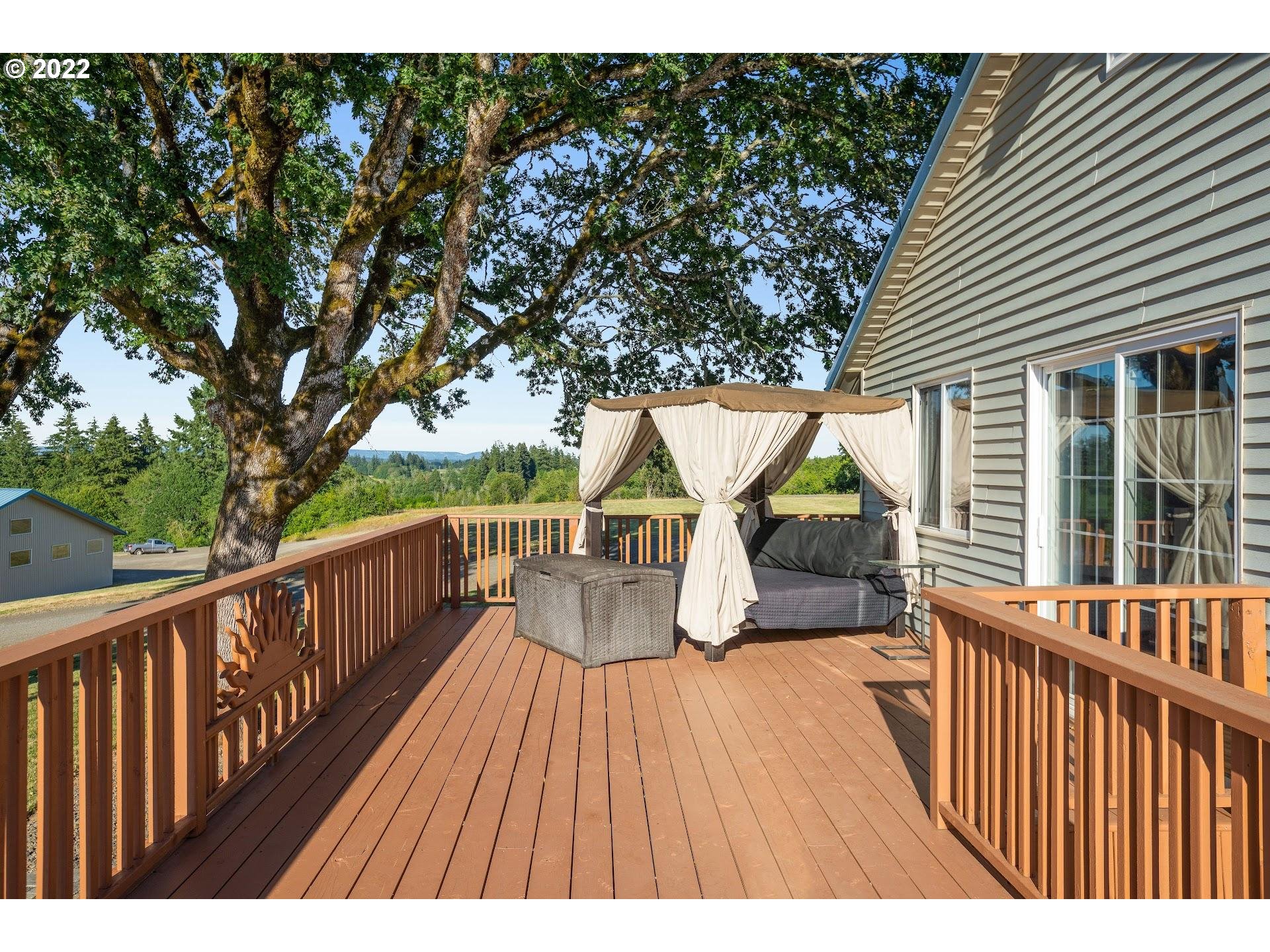 3995 Southwest Lafollett Road Cornelius, OR 97113 - Photo 17 of 32 a balcony with wooden floor and outdoor seating