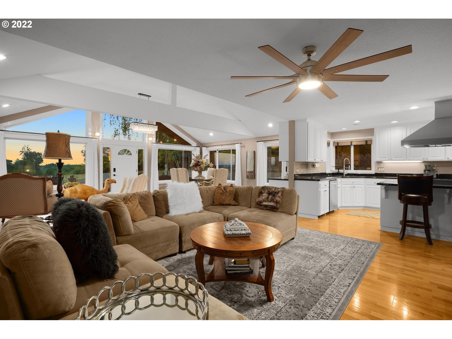 3995 Southwest Lafollett Road Cornelius, OR 97113 - Photo 3 of 32 a living room with furniture kitchen view and a wooden floor