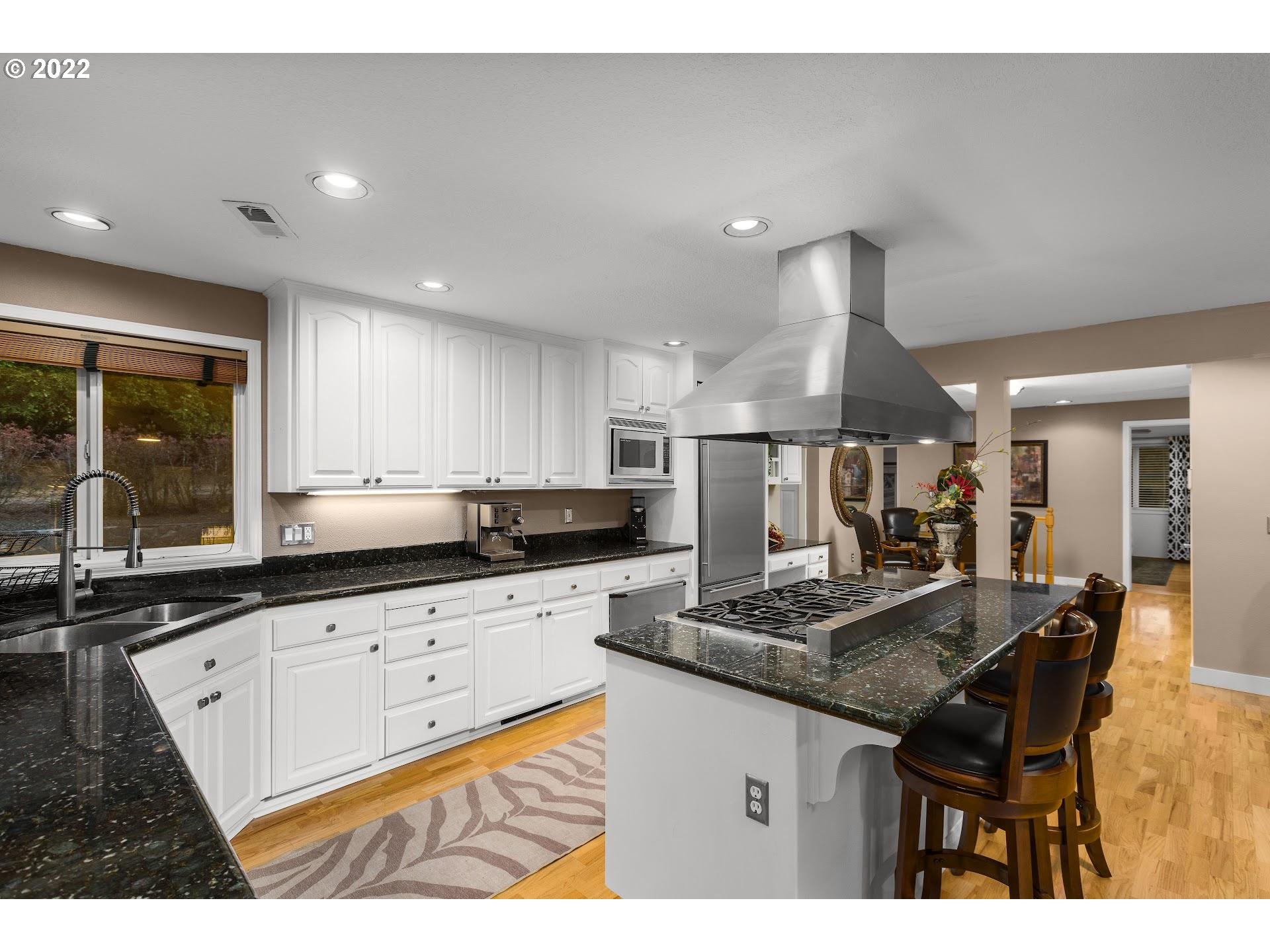 3995 Southwest Lafollett Road Cornelius, OR 97113 - Photo 9 of 32 a kitchen with granite countertop a sink and cabinets