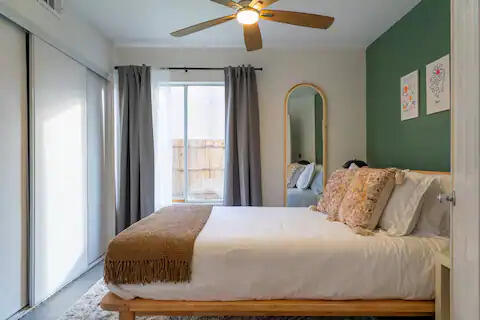 81032 Red Bluff Road Indio, CA 92201 - Photo 22 of 33 a bedroom with a bed and a large mirror