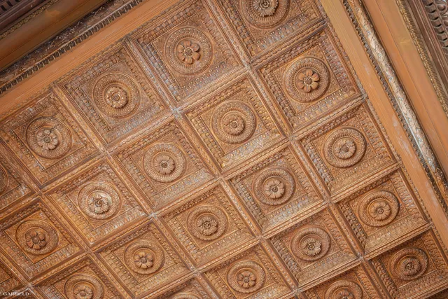 a kitchen with granite countertop stainless steel appliances a sink and a refrigerator