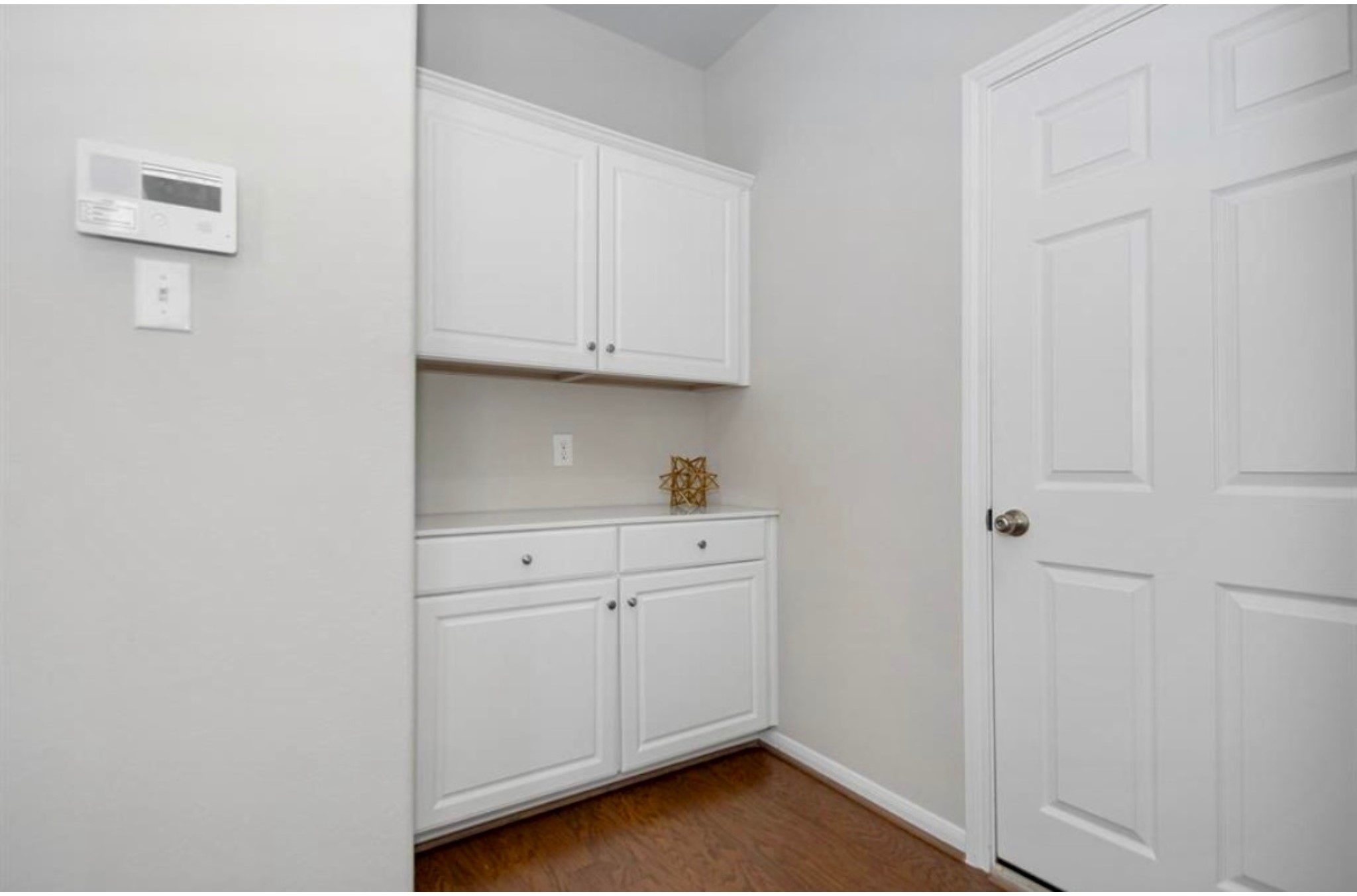 10406 Mount Winchell Drive Iowa Colony, TX 77583 - Photo 12 of 16 a view of a kitchen with white cabinets
