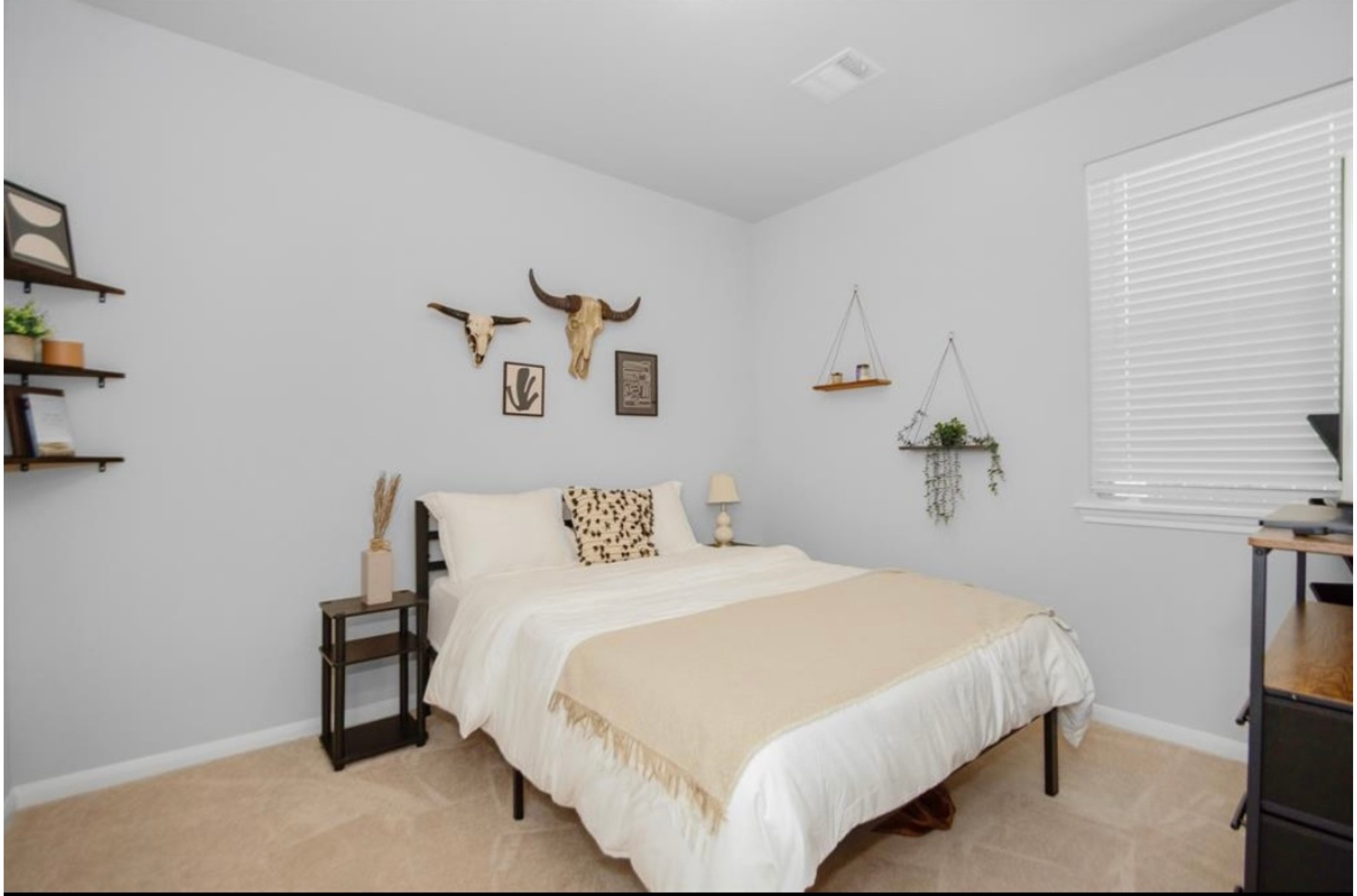 10406 Mount Winchell Drive Iowa Colony, TX 77583 - Photo 14 of 16 a bedroom with a bed and a table