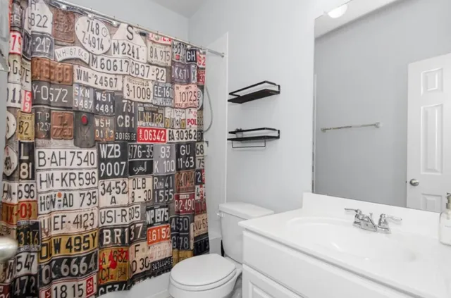 a view of a house with a backyard