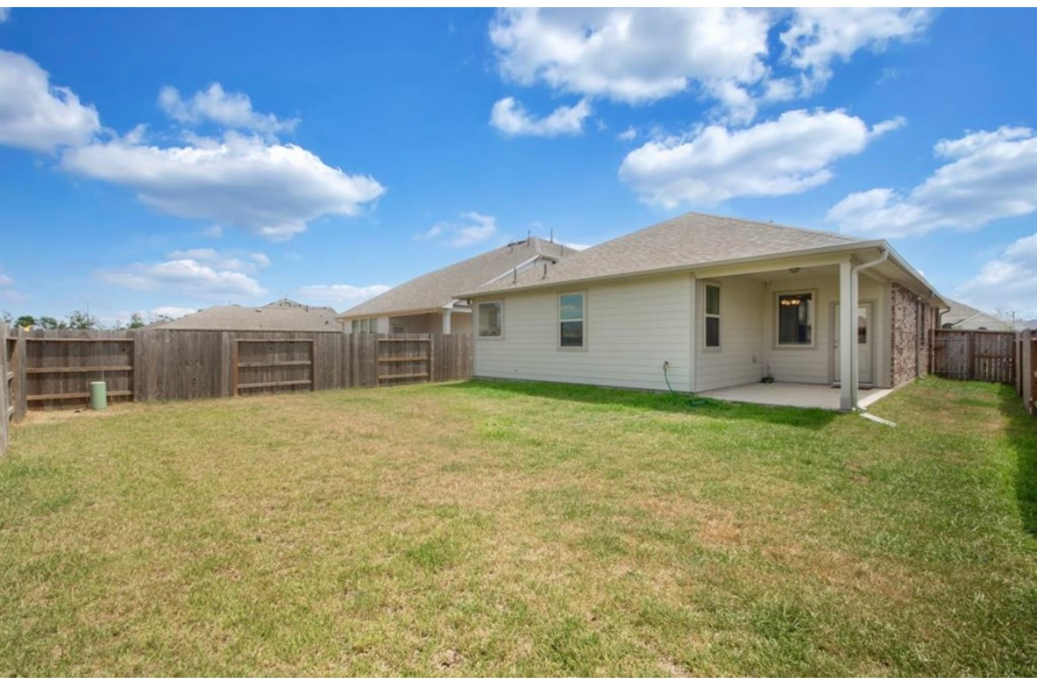 10406 Mount Winchell Drive Iowa Colony, TX 77583 - Photo 16 of 16 a view of a house with a backyard