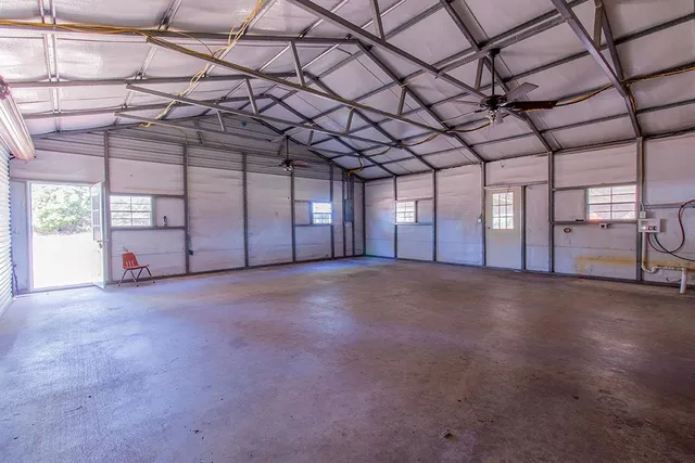 a view of empty room with windows