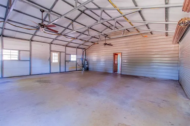 a view of empty room with white walls