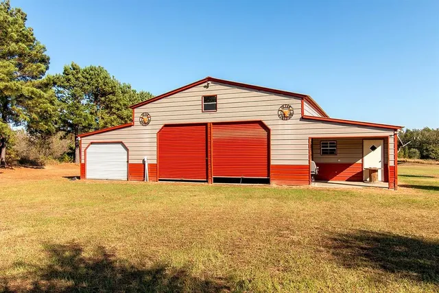 a big house with palm trees in front of it