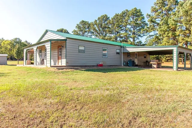 a house view with swimming pool in front of it